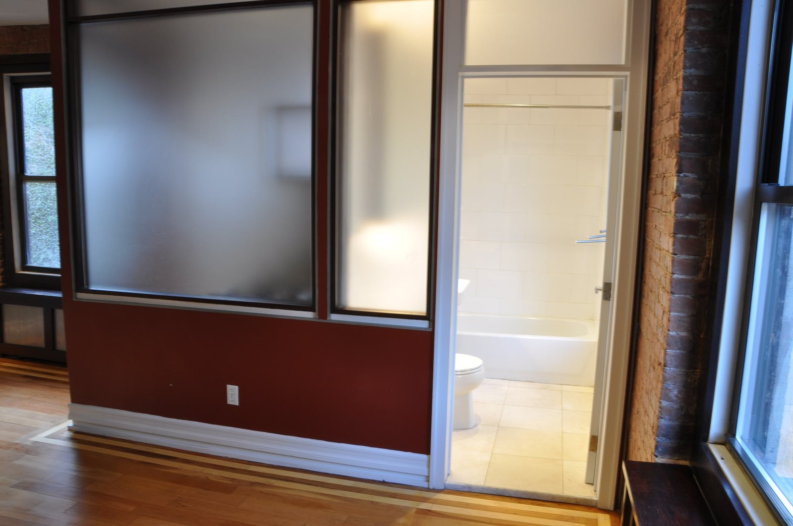 View of bathroom through frosted-glass partition