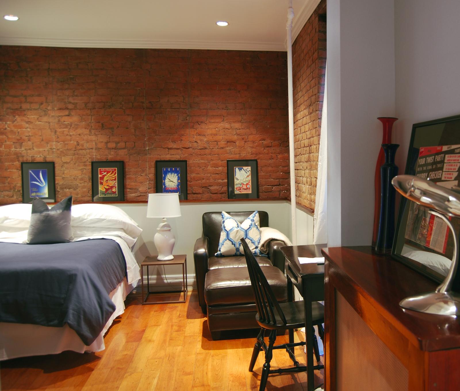 Main room with exposed brick wall